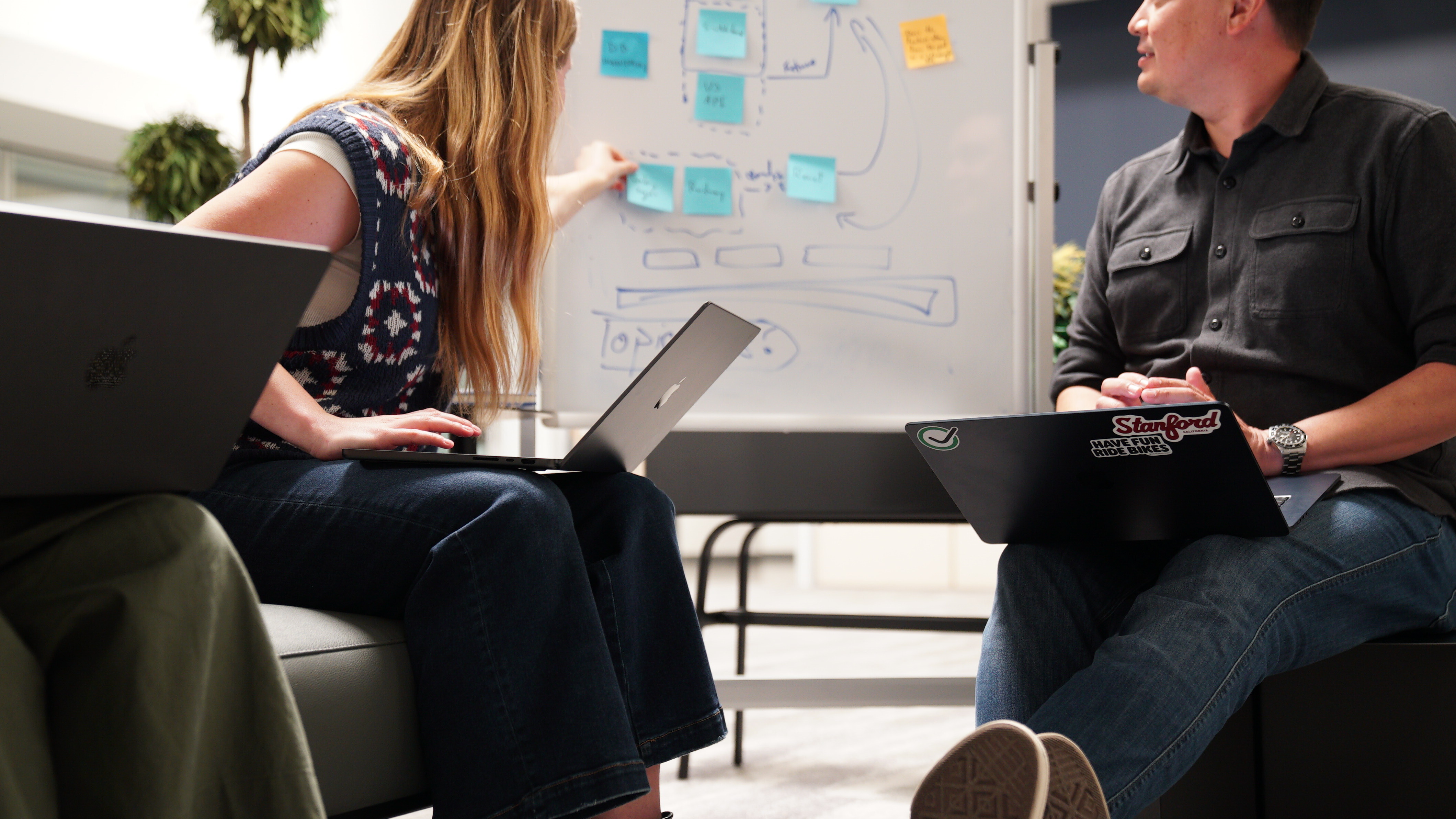 A team at work, looking at sticky notes