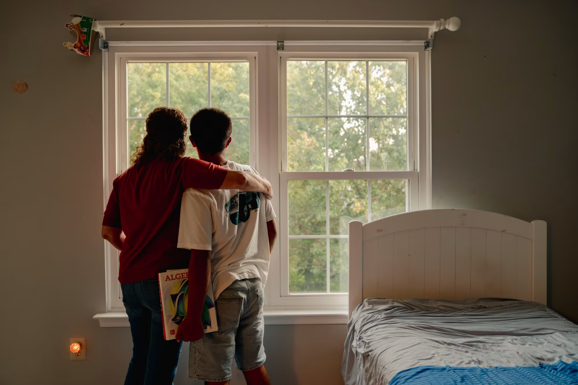 Parent and child at a window