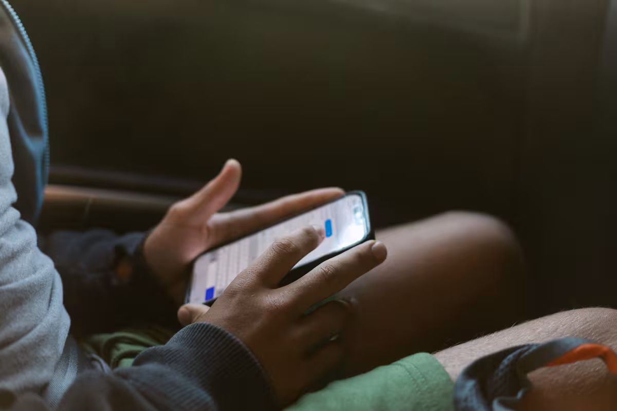 Tween holding a phone