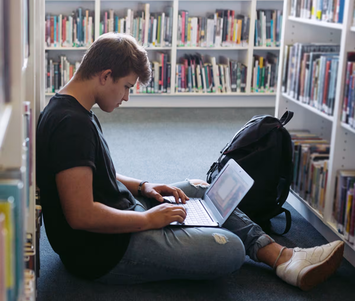 Student at laptop in the library